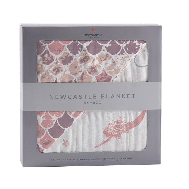 Mermaids and Scales bamboo muslin Newcastle blanket in packaging.