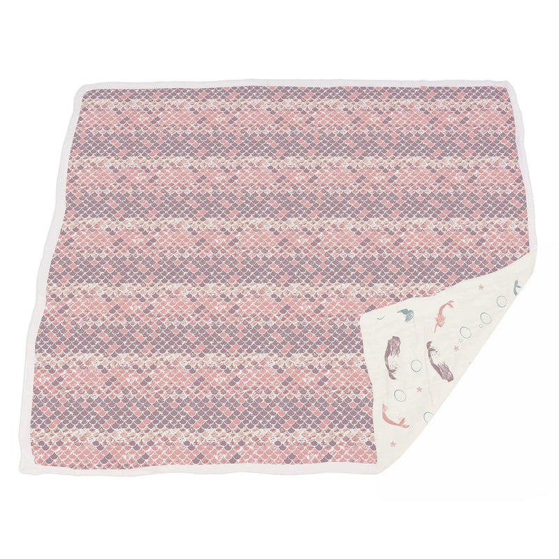 Mermaids and Scales bamboo muslin blanket with cozy four-layer design.