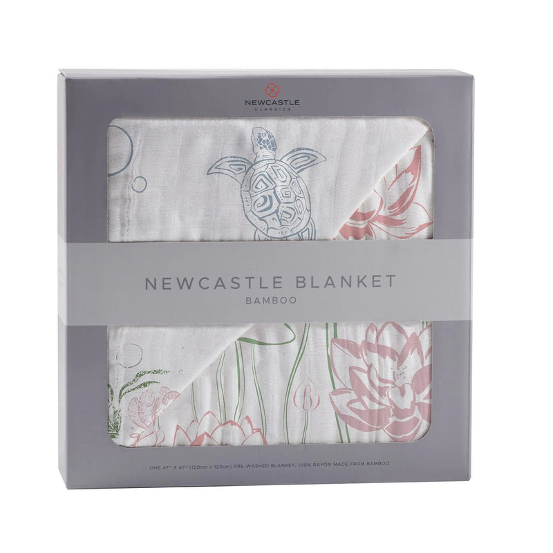 Turtles and Water Lily Bamboo Muslin Blanket in packaging.