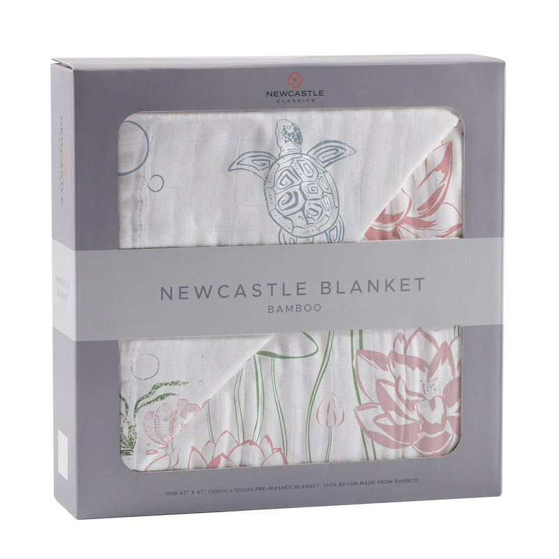 Turtles and Water Lily bamboo muslin blanket in packaging, featuring soft breathable natural bamboo fibers.