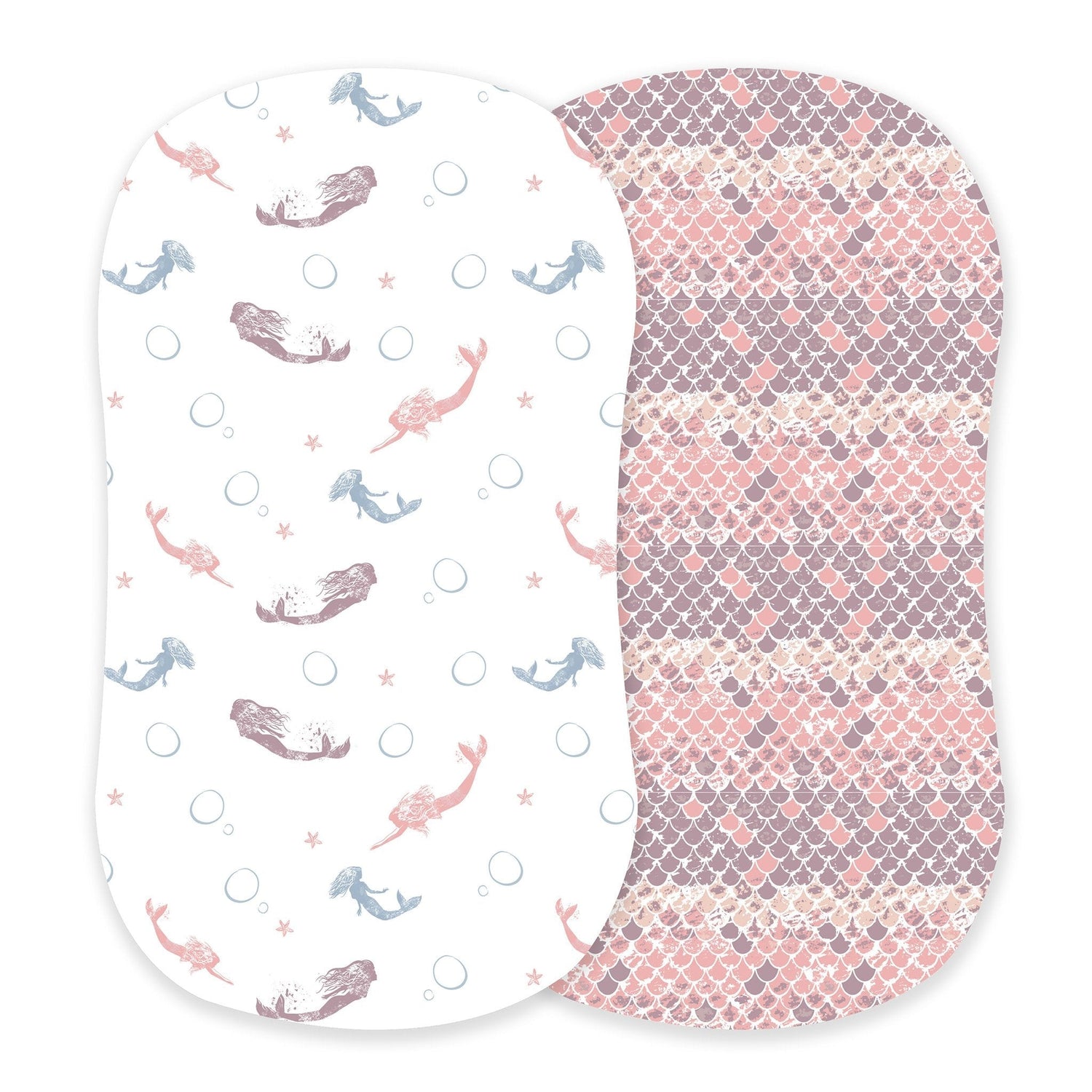 Bassinet sheet with a pink mermaids and scales pattern fitted on a bassinet mattress