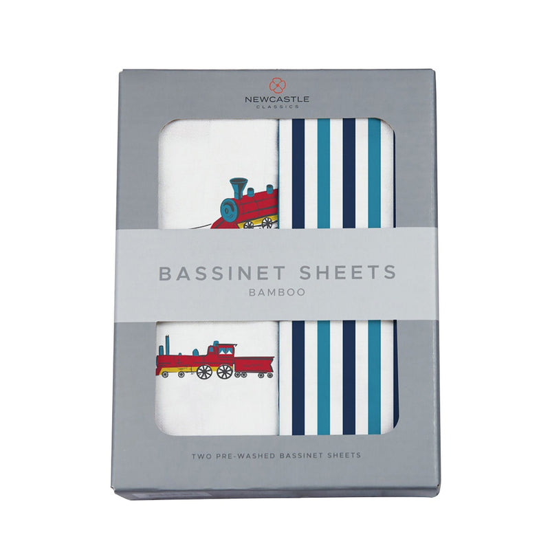 Vintage steam train and blue stripe bamboo bassinet sheets in packaging.