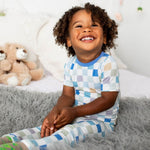 Short sleeve baby pajama set with a checked pattern, matching short-sleeve top and long pants.