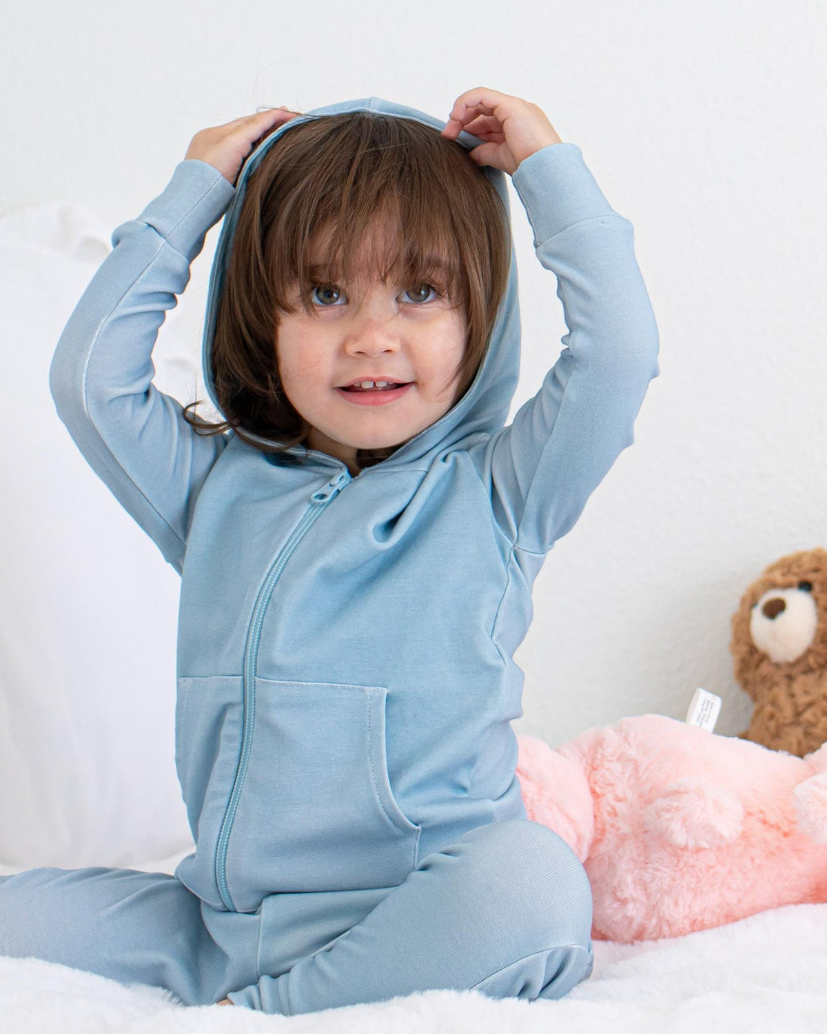 Baby zip-front hoodie in a solid color with lined hood and kangaroo pockets