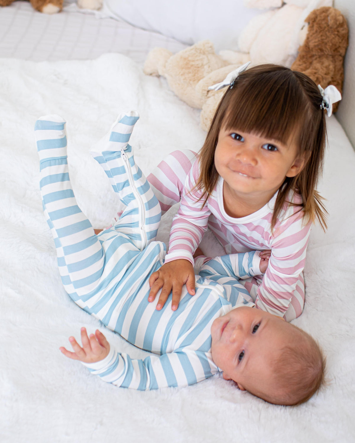 Baby footie pajamas in a striped print with a full-length two-way zipper and covered feet