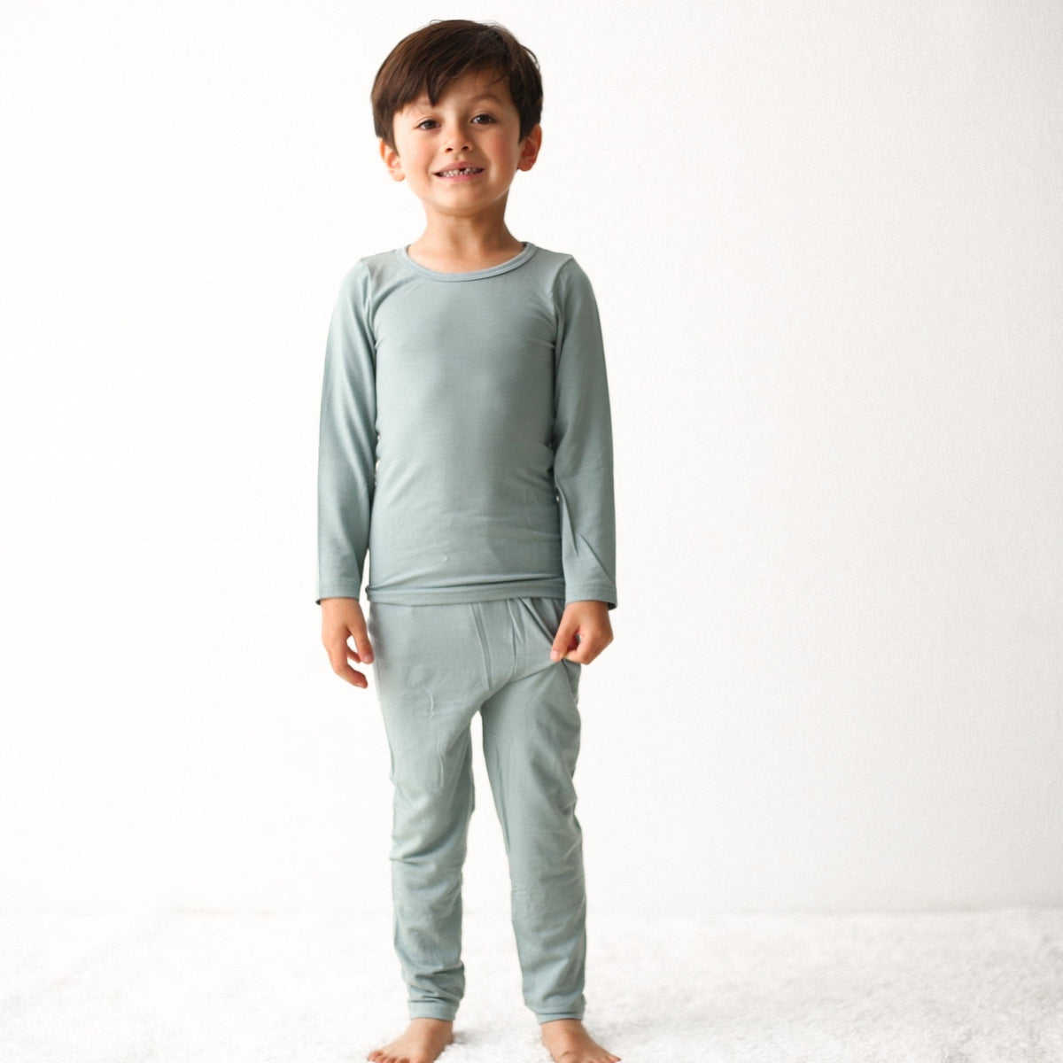 Two-piece toddler pajamas in slate gray with a long-sleeve top and matching pants