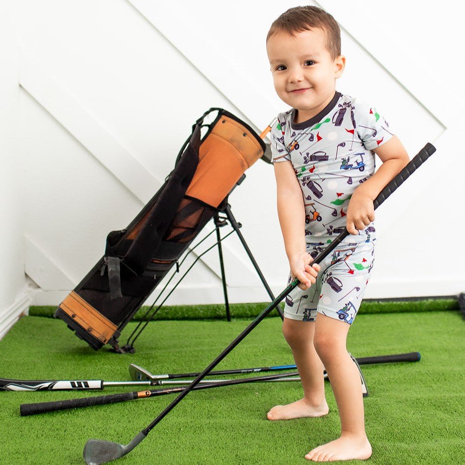 Short sleeve baby pajama top and shorts set in a baseball print