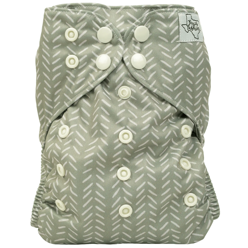 Slim Fit AIO Cloth Diaper with adjustable snaps and patterned design.