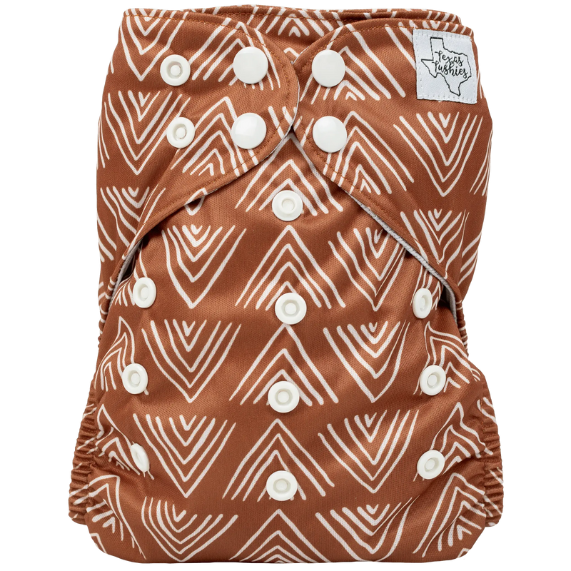Slim Fit AIO Cloth Diaper with brown and white patterned design, featuring simplified snaps and wicking jersey material for comfort.