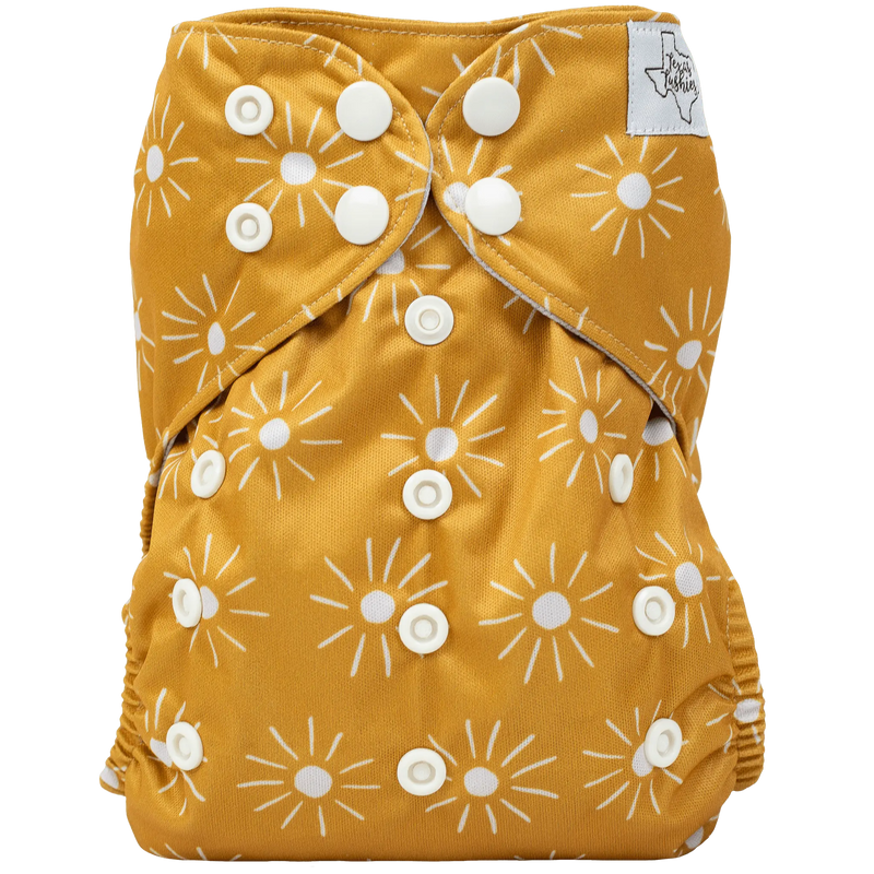 Slim Fit AIO Cloth Diaper with sun pattern and white snaps.