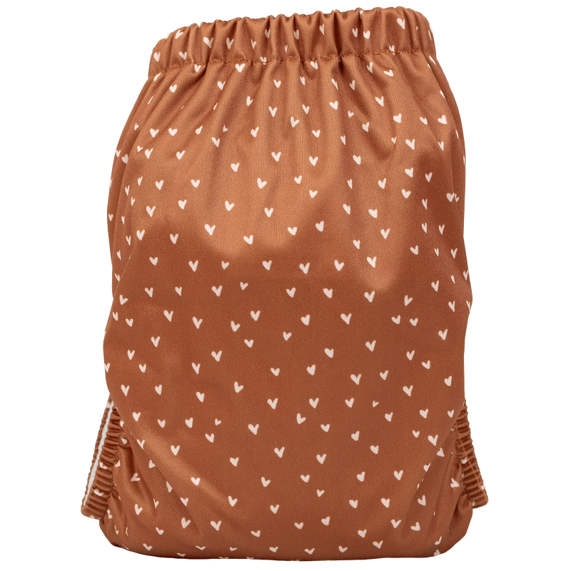 Slim Fit AIO cloth diaper with heart pattern, lightweight, reusable, and adjustable for babies 8-40lbs.