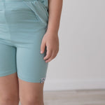 Toddler biker shorts in a colorful snow cone print, cut in a fitted short style.