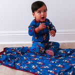 Baby footie pajamas in a soccer ball print with fold-over mittens, foot grips, and a full-length dual zipper.