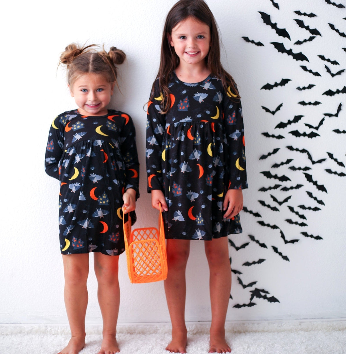 Long-sleeve toddler dress with a Halloween-themed print, made for twirling