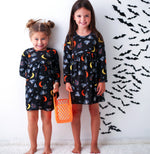 Long-sleeve toddler dress with a Halloween-themed print, made for twirling