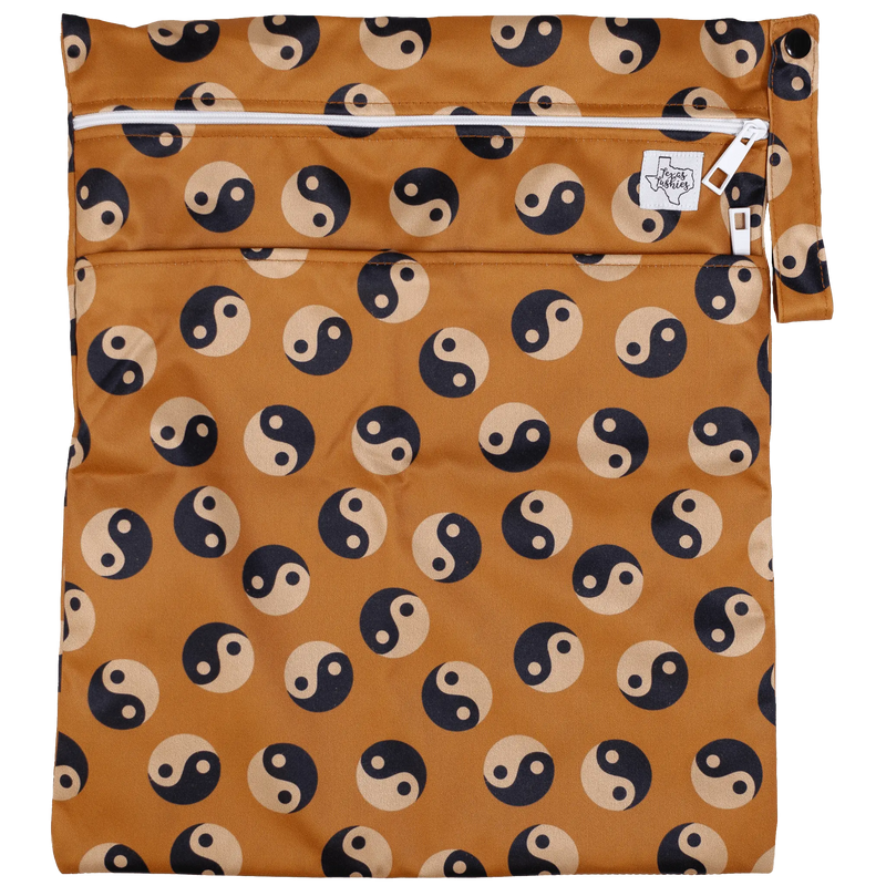 Texas Tushies Wet/Dry Bag with yin-yang pattern, double zipper, strap, 12x16 inches, water-resistant.