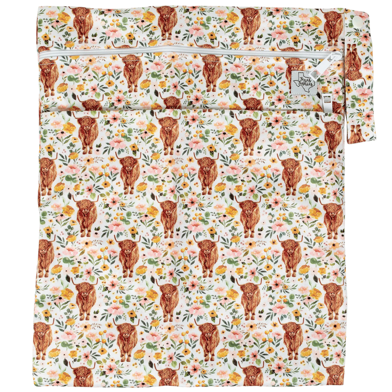 Texas Tushies Wet/Dry Bag with floral and animal print, double zipper, and strap.