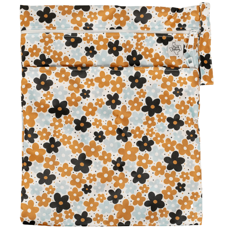 Texas Tushies Wet/Dry Bag with floral print, double zipper, and durable strap.