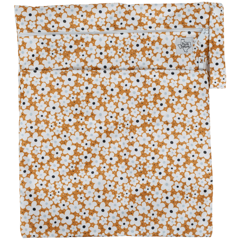 Texas Tushies Wet/Dry bag with floral print, featuring double zippers and strap.