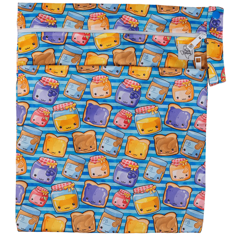 Texas Tushies Wet/Dry Bag with colorful print, dual compartments, and strap.