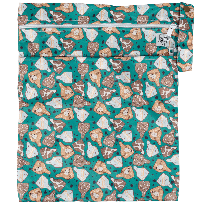 Texas Tushies Wet/Dry bag with a colorful patterned design, featuring double zipper and strap, ideal for cloth diapers.