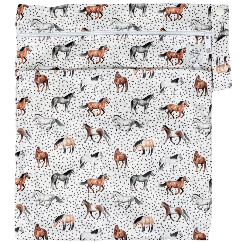 Texas Tushies Wet/Dry bag with horse pattern, double zipper, and strap.