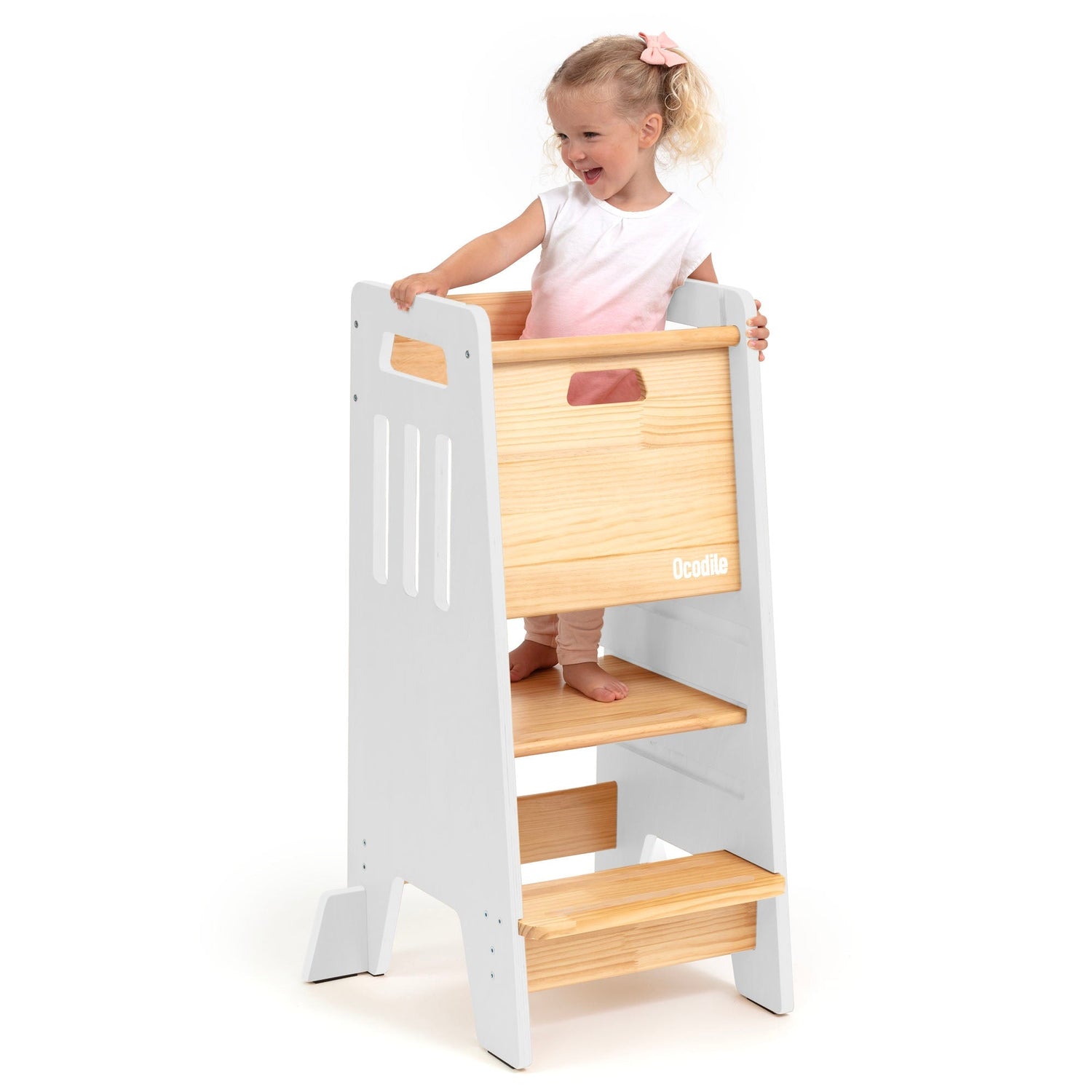 Ocodile organic wooden learning tower with safety door, natural finish, child standing at counter height