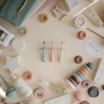 Mushie Star Training Toothbrush for Kids with Soft Silicone Bristles and Gentle Gum Care - Everetts Place Boutique - 