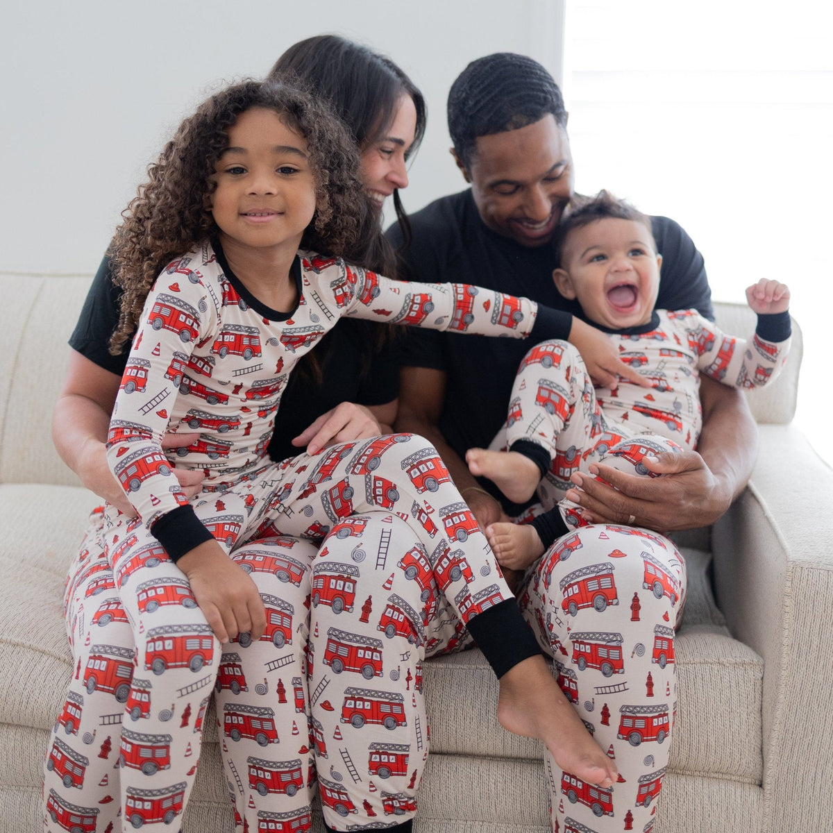 Adult unisex joggers in a firefighter station print, laid flat.