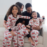 Adult unisex joggers in a firefighter station print, laid flat.