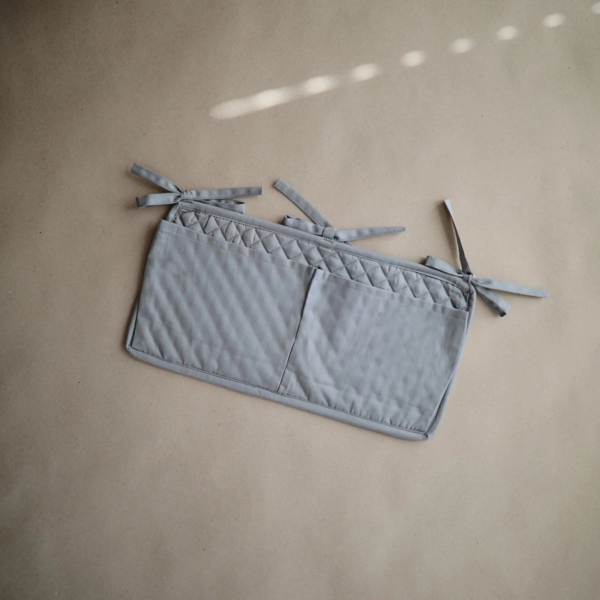 Mushie Storage Pocket for Baby Essentials with Adjustable Ribbon Ties - Everetts Place Boutique - 