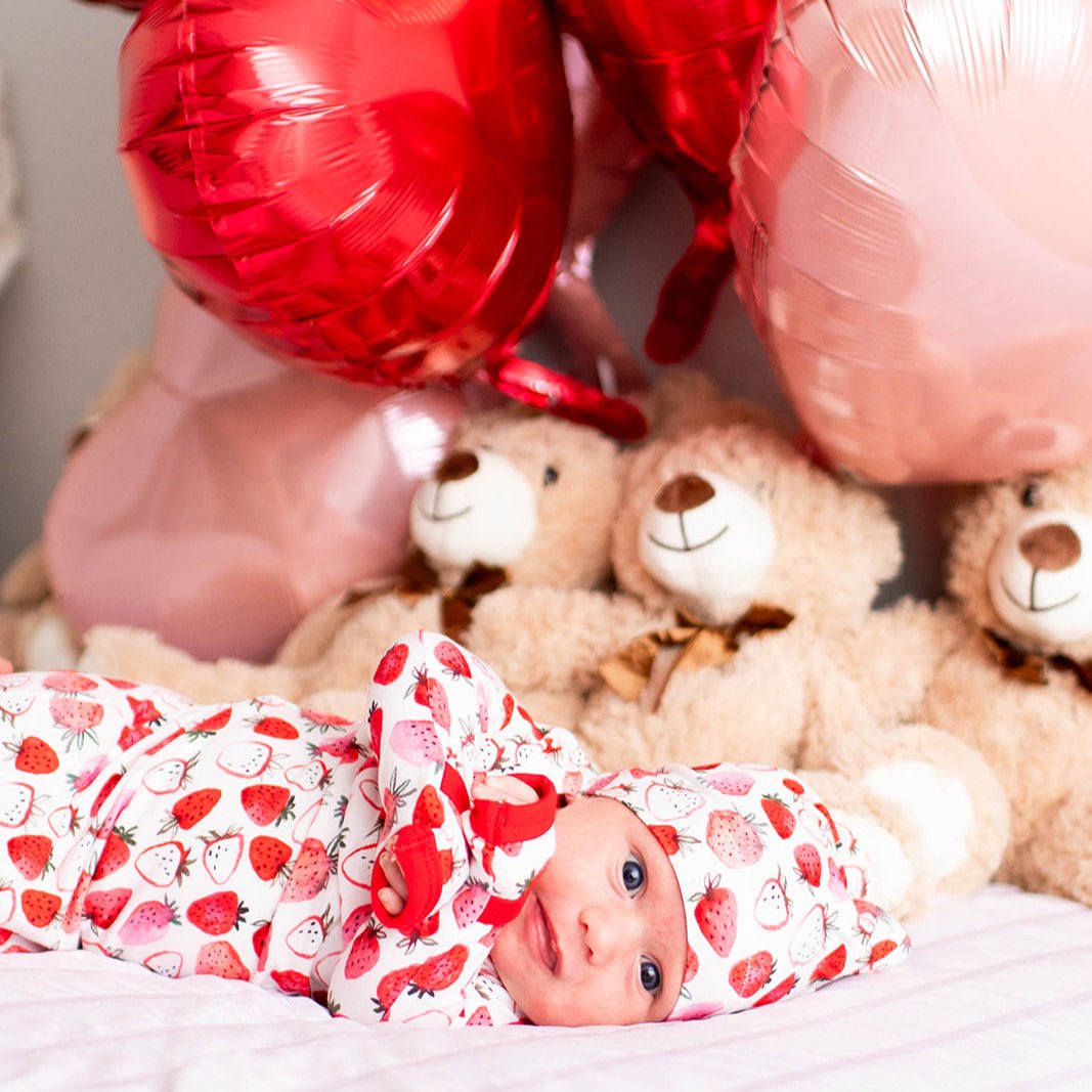 Baby gown and matching hat in a pink and red strawberry print with fold-over hand mittens