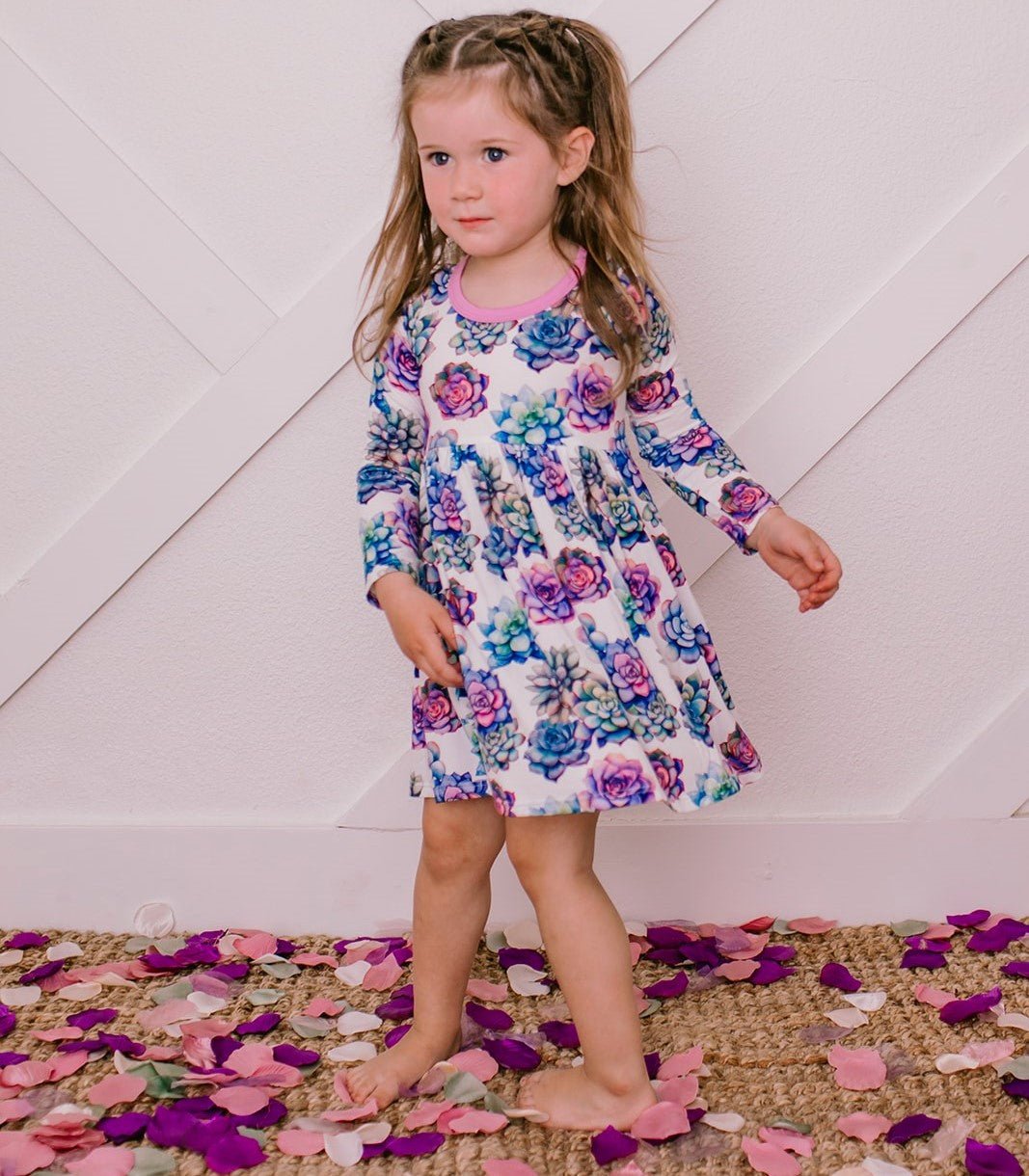 Long sleeve twirl dress with a whimsical green succulents print and full skirt for spinning.