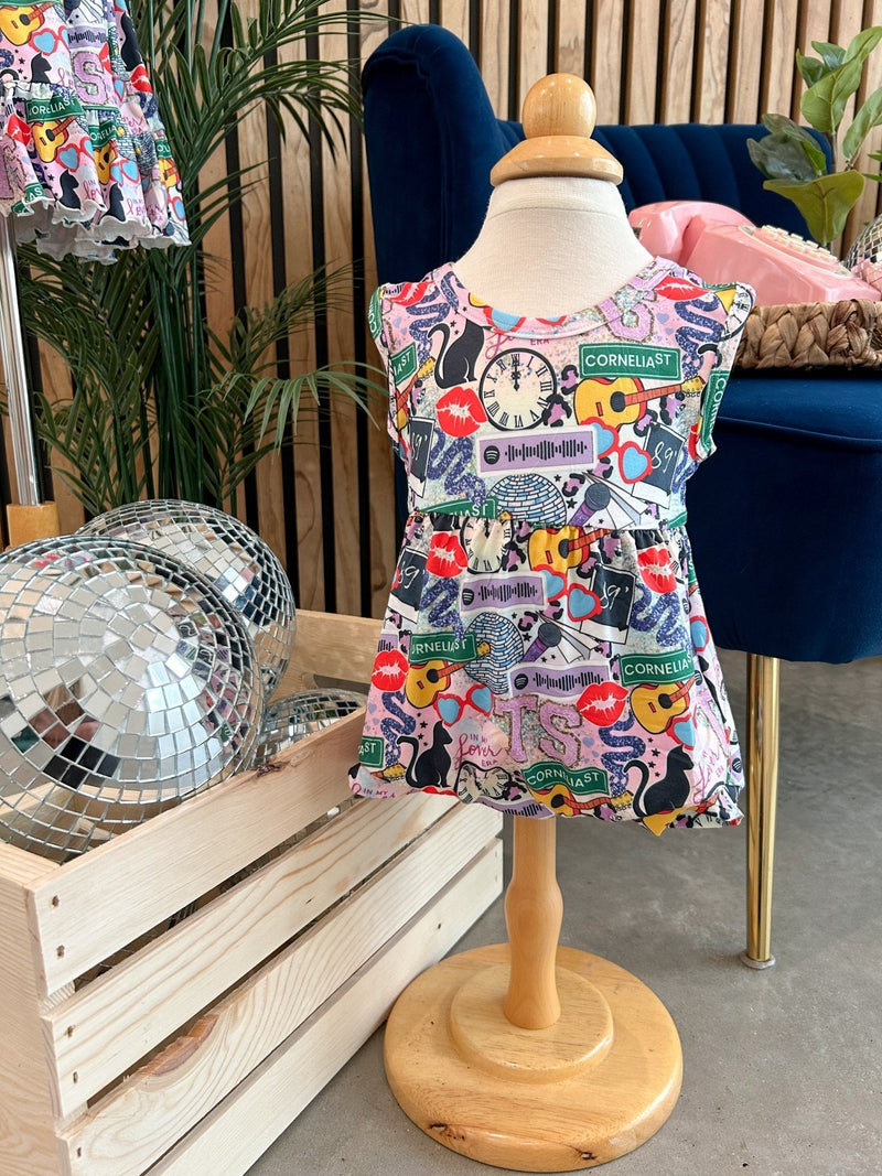 Colorful summer boxy romper with playful patterns on a mannequin, ideal for warm weather.