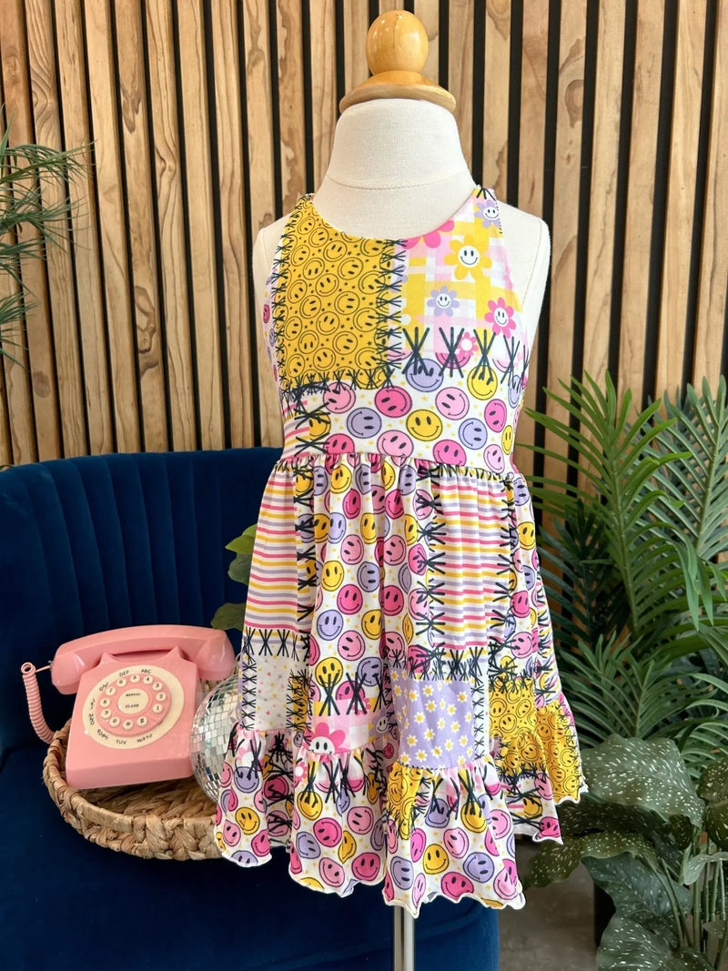 Summer Ruffle Dress with colorful patterns displayed on a mannequin in a stylish setting.