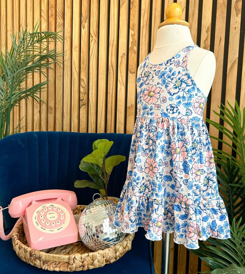 Summer Ruffle Dress with blue and pink floral pattern on display mannequin.