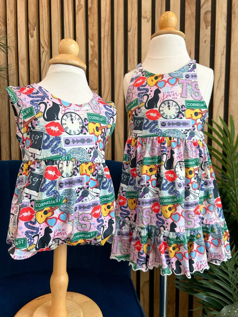 Summer Ruffle Dress with vibrant patterns displayed on mannequins.