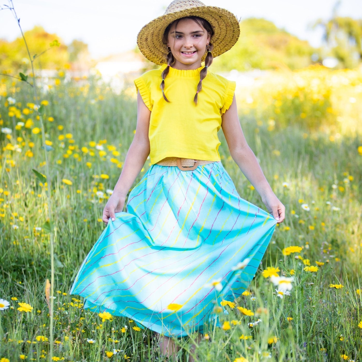 Bright colorful baby lehenga dress with an elastic waist and wooden buttons down the back.