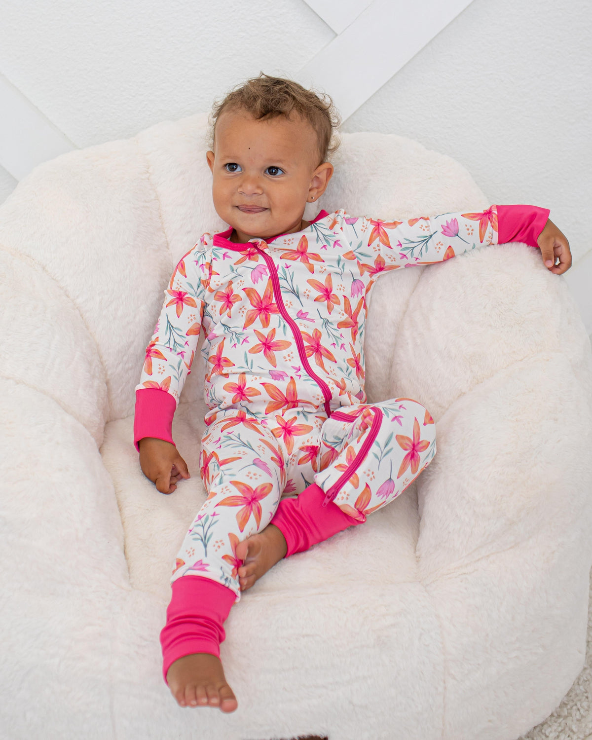Baby convertible coverall in Sunset Leilani print with two-way zipper and convertible feet