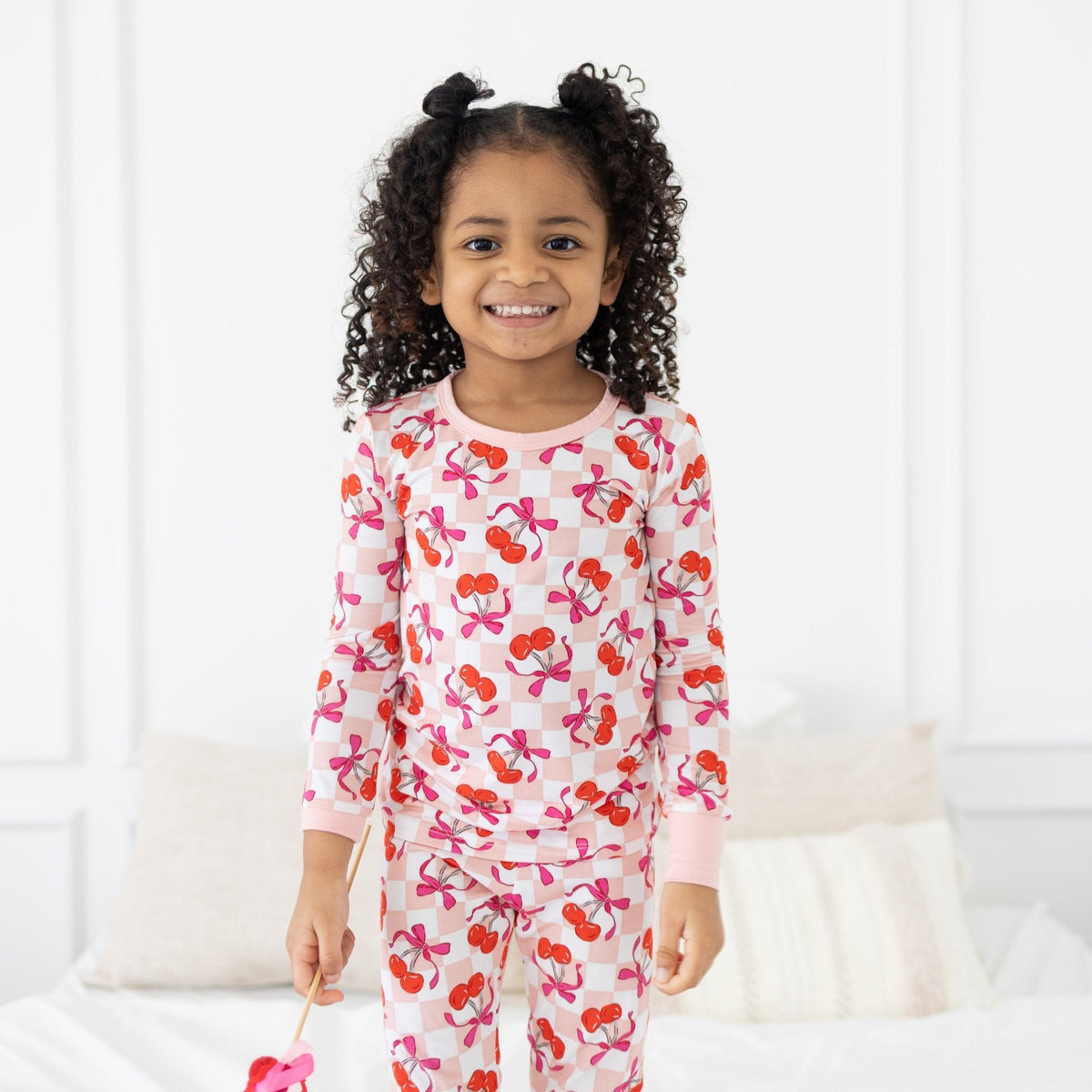 Toddler bamboo pajama set with a sweet cherry print and fold-over feet