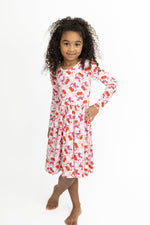 Long sleeve twirl dress in pink checker print with cherries and bows