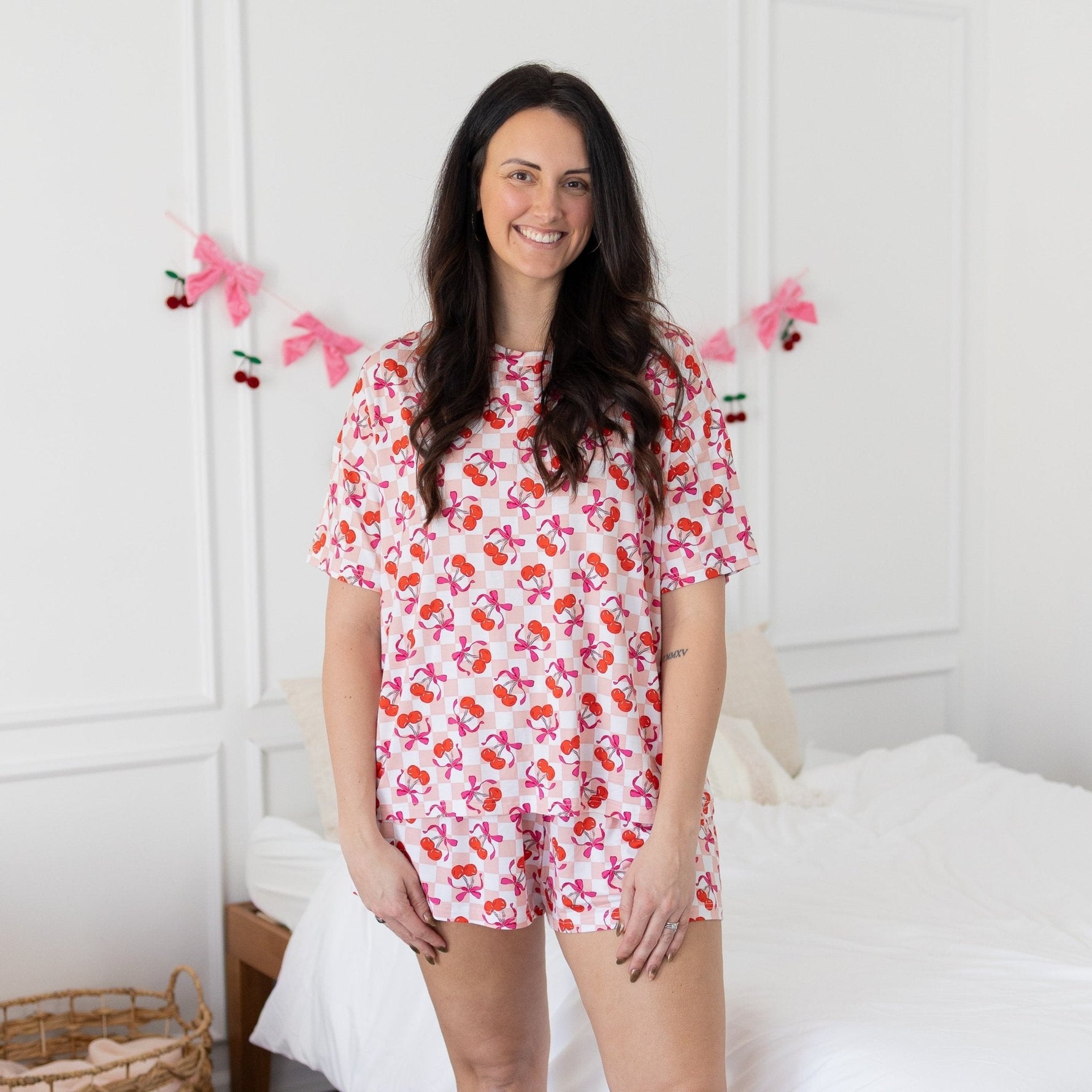 Women's short-sleeve tee and boxer-style shorts set in pink with a cherry print.