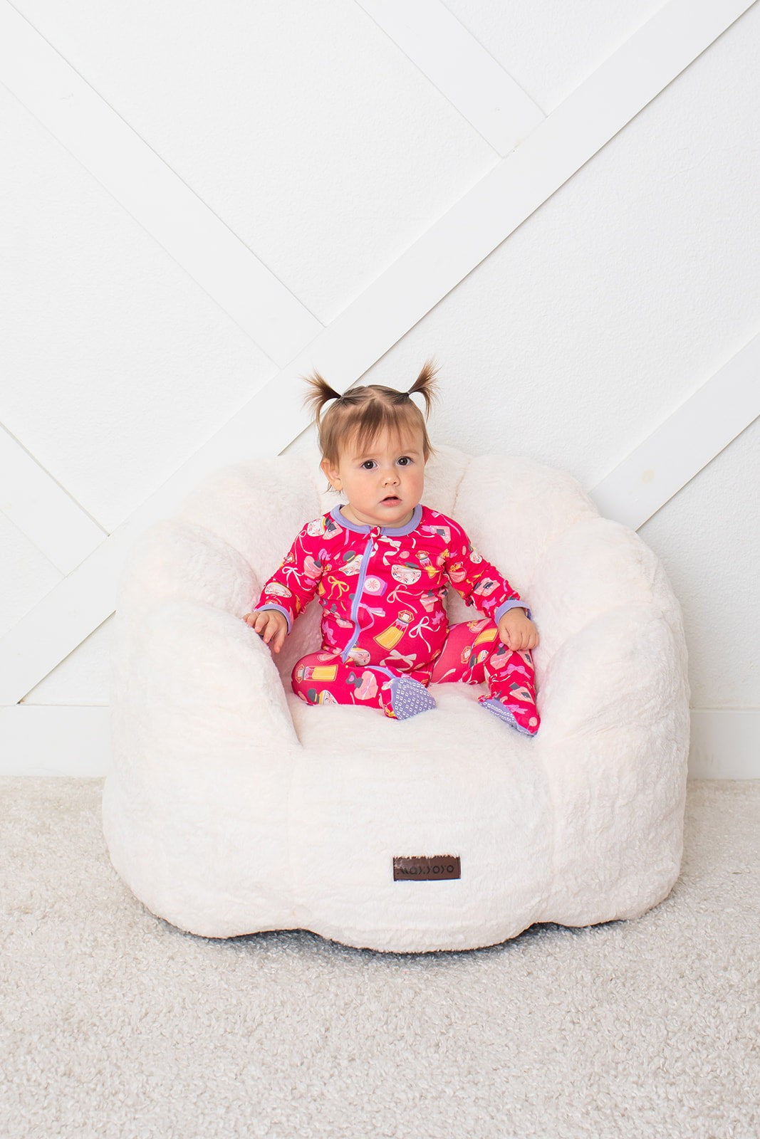 Baby footie pajamas in Sweet Scent print with a full-length two-way zipper and covered feet