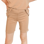 Tan toddler biker shorts laid flat, a fitted classic style in a solid neutral shade.
