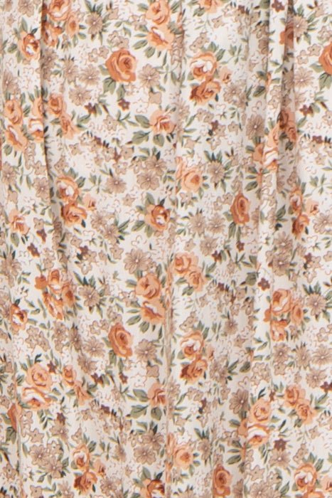 Woman wearing a Taupe Floral Smocked Puff Sleeve Maternity Midi Dress with floral print