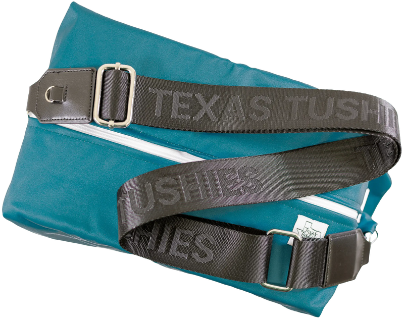 Texas Tushies Exclusive Pod Strap with adjustable black strap and silver hardware attached to a blue bag.