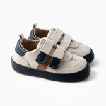 Toddler sneakers with double Velcro straps, sporty double athletic stripe, and a wide opening.
