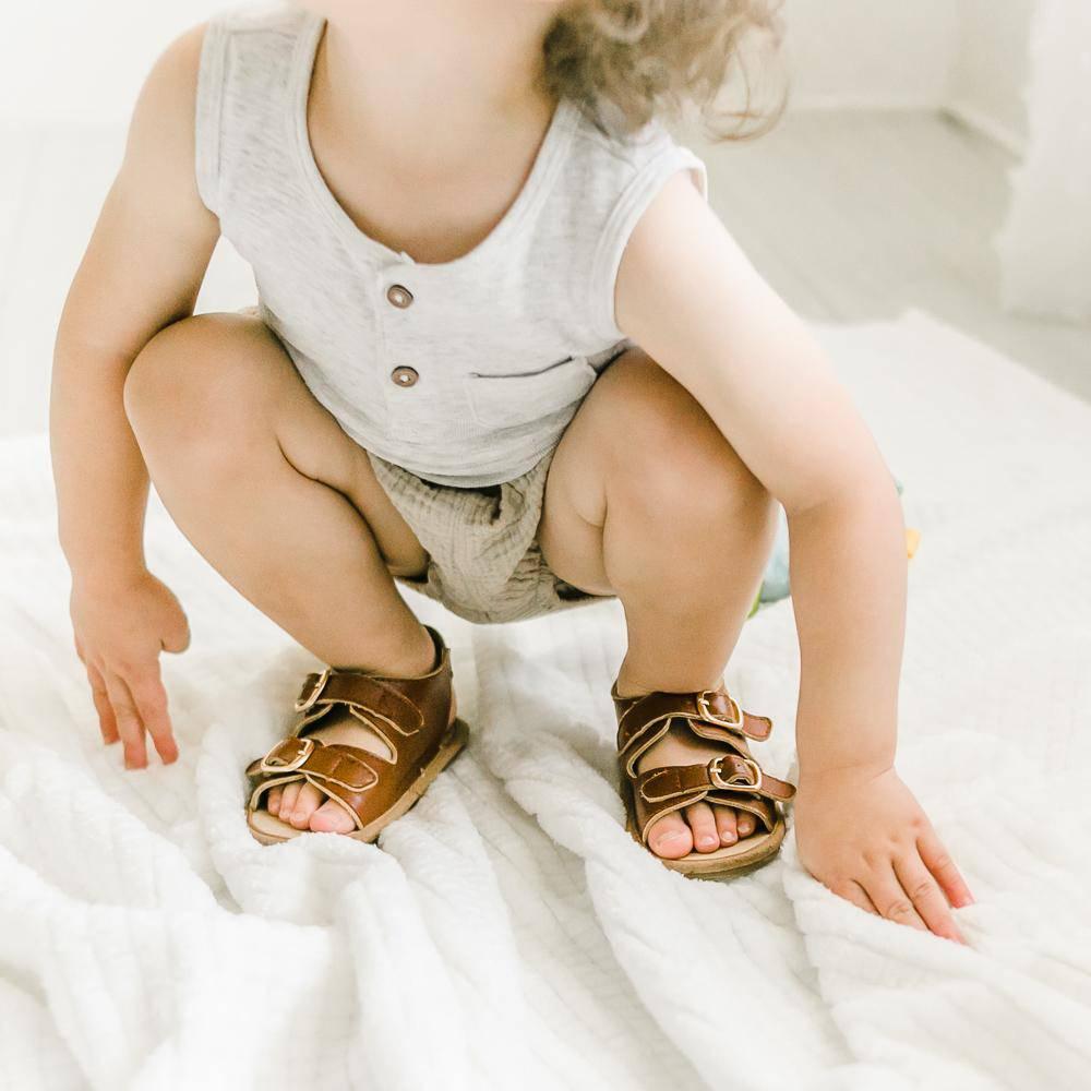 Little Love Bug Co. Charley tan leather baby moccasins.
