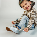 Little Love Bug Co. The Milo tan natural baby moccasins.