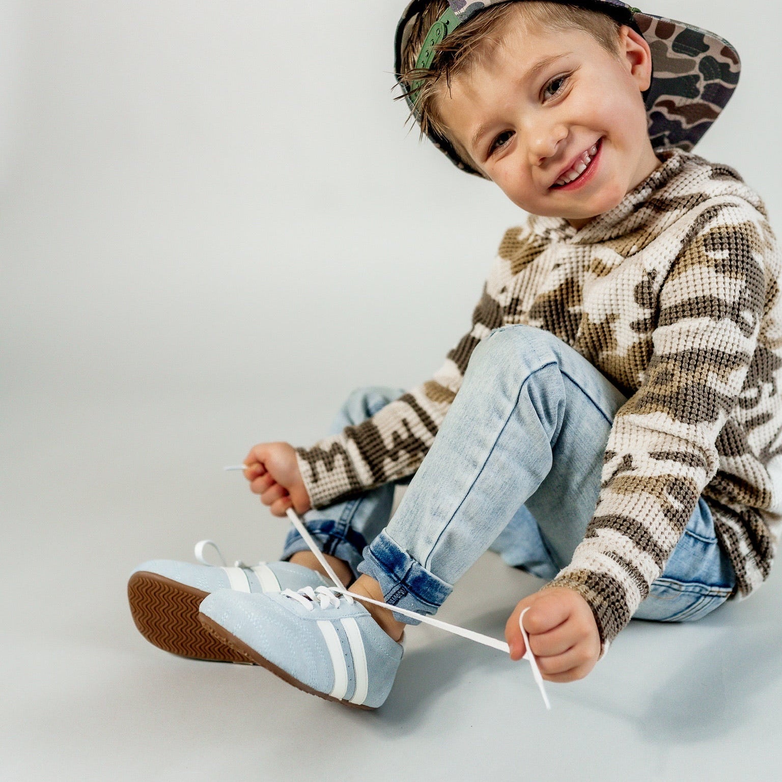 Little Love Bug Co. The Milo tan natural baby moccasins.